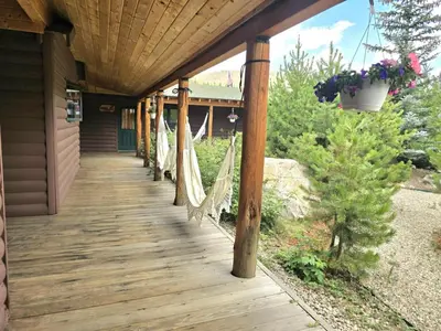 a porch with hammocks on a house at Black Bear Studio in Tranquil Courtyard by Grand Luxe in Grand Lake