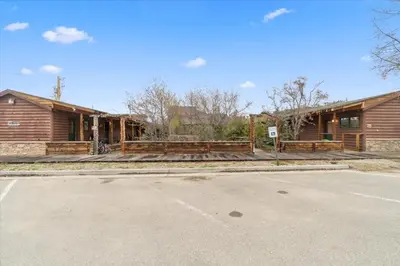 an empty parking lot in front of a house at Black Bear Studio in Tranquil Courtyard by Grand Luxe in Grand Lake