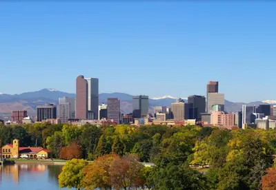 a cityscape of a city with a lake and buildings at Spacious Studio with King Bed & Fast WiFi in Denver