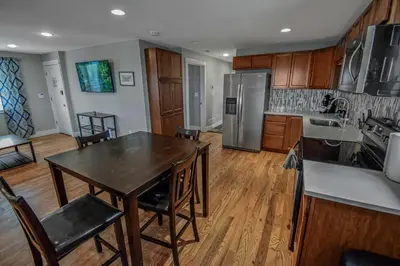 a kitchen with a table and chairs in a room at Cozy and Budget Friendly Single Bedroom in the Heart of Denver in Denver