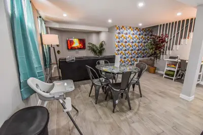 a dining room with a table and chairs at Vibrant & Cozy Two Bedroom Lower Unit King Beds in Denver
