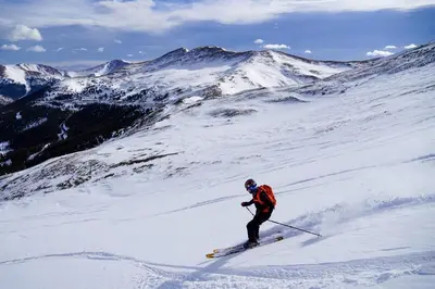 a person is skiing down a snow covered mountain at Victorian Dream! Charming Mountain View Home by Downtown in Georgetown