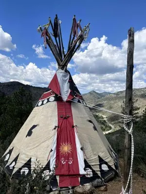 a teepee with a tree on top of a mountain at Raven's Ridge Luxurious Tipi in Golden, Colorado in Golden