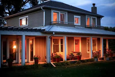 a house with a front porch with a patio at Western-Style Ranch Getaway for Two Guests near Fort Collins, Colorado in Livermore