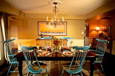 a dining room with a table with chairs and a chandelier at Gorgeous Ranch Stay Accommodation with Amazing Views in Livermore, Colorado in Livermore