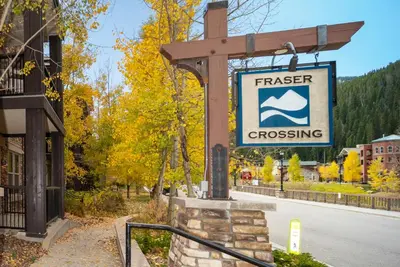 a sign for a creek crossing on a street at Fraser Crossing 3227 Ski In Ski Out Winter Park Resort in Winter Park