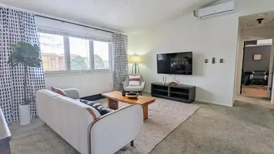 a living room with two couches and a television at Cozy Monthly 1BR Near NREL & Trails - Quaker Room 1 in Golden