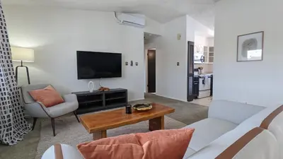 a living room with a couch and a table at Cozy Monthly 1BR Near NREL & Trails - Quaker Room 1 in Golden