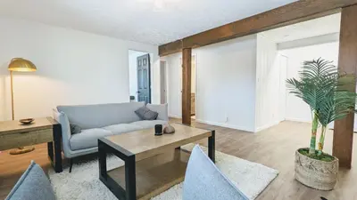 a living room with a couch and a table and chairs at Charming 1BR Close to Trails & NREL Monthly Rental - Quaker Room 2 in Golden
