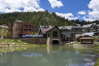 a large body of water in front of a resort at Fraser Crossing cabin in Winter Park
