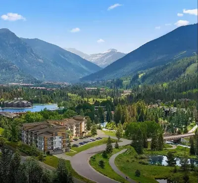 an aerial view of a resort with a river and mountains at Luxury Stay Meets Family Fun- Premier 1BR Retreat condo in Keystone