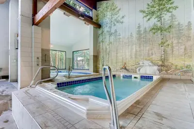 a large pool with a hot tub in a house at 1-Bedroom plus Loft at The Pines with Forest Views, No Cleaning Fees, Kids Ski Free condo in Keystone