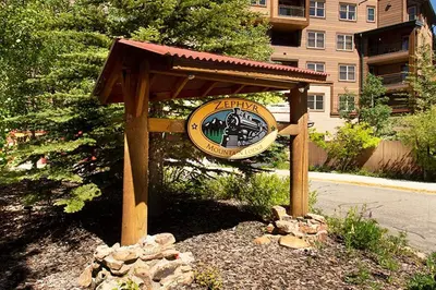 a sign for a train station on the side of a street at Ski-In Ski-Out Zephyr 1 Bedroom Condo 2204 in Winter Park