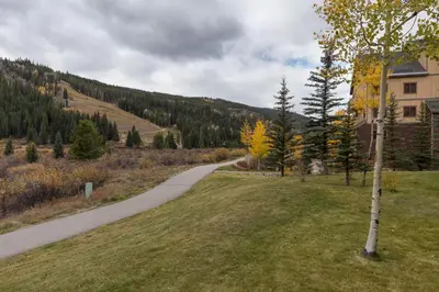 a path in a field next to a house at Springs 8887 in Keystone