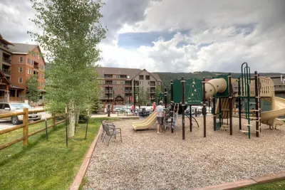 a park with a playground with a slide at Dakota Lodge 8512 in Keystone
