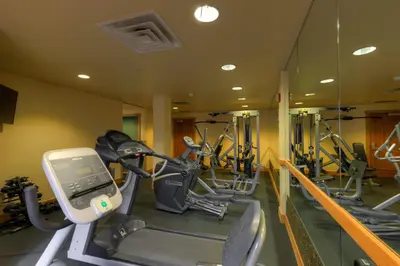 a gym with several tread machines in a row at Expedition Station 8569 in Keystone