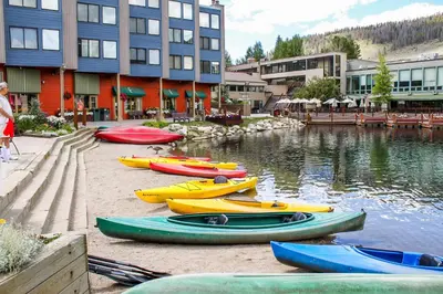 a group of kayaks parked next to a body of water at Expedition Station 8569 in Keystone