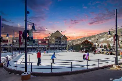 a group of people skating on an ice rink at Timbers 3074 in Keystone