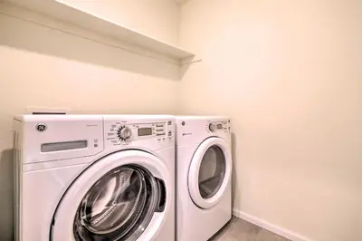 a white washer and dryer in a laundry room at Charming 3BR Retreat - Perfect for Families in Fort Collins