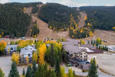 an aerial view of a house in the forest at 2795 Slopeside condo in Keystone