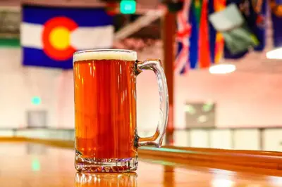 a mug of beer sitting on a table at St Marys Glacier Getaway in Idaho Springs