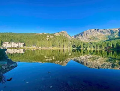 a view of a lake with mountains in the background at Blue Bear - Perfect Mountain Getaway in Idaho Springs