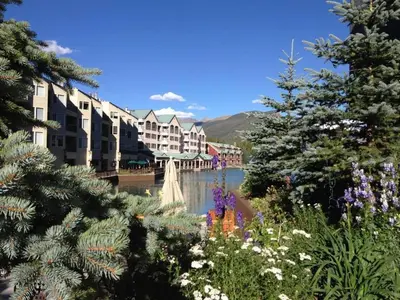 a view of a town with a pond and buildings at Seasons at Keystone 1893 in Keystone