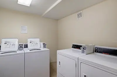 a laundry room with two washers and two dryers at Oro Grande 416 in Keystone