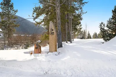 a sign in the snow next to some trees at Oro Grande 416 in Keystone