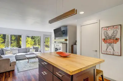 a kitchen with a kitchen island in a living room at 1928 Soda Ridge in Keystone