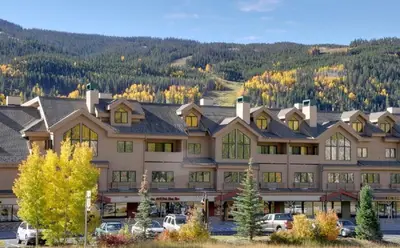 a large building with cars parked in front of it at #5075 Keystone in Keystone