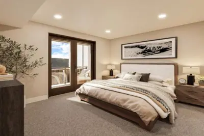 a bedroom with a large bed and a balcony at Kindred Resort Luxury Ski In, Ski Out 1 Bedroom Residence At The River Run Gondola in Dillon