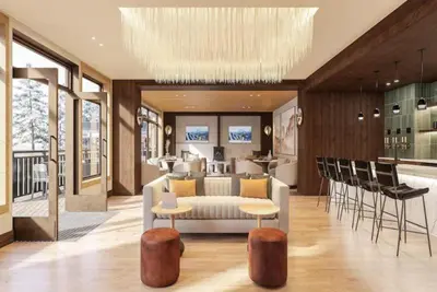 a living room with a couch and chairs and a kitchen at Kindred Resort Luxury Ski In, Ski Out 1 Bedroom Residence At The River Run Gondola in Dillon