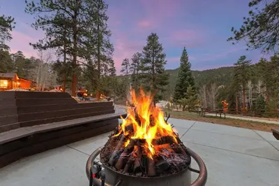 a large fire in a pot on a sidewalk at Cabin 14 - King Bed hotel-style unit in Estes Park
