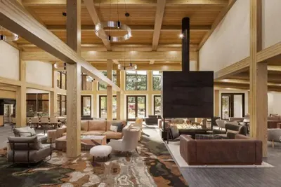 a large living room with couches and a large screen at Kindred Resort Luxury Ski In, Ski Out 3 Bedroom Residence At The River Run Gondola in Dillon