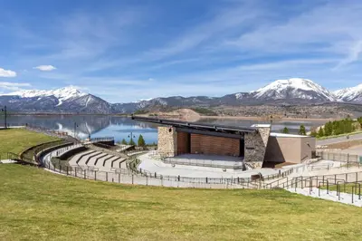 a rendering of a building with mountains in the background at Lakeshore 1 in Keystone