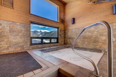 a jacuzzi tub in a room with a window at Tennis Townhome Unit 1321 in Keystone