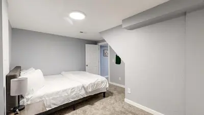 a bedroom with a white bed in a room at Family Home in Arvada with king beds and bunkbed in Arvada