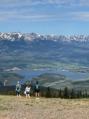 a group of three people standing on top of a mountain at Gateway Lodge 5008 by SummitCove Lodging in Keystone