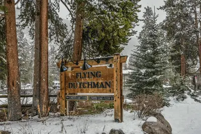 a sign for a hiking dothan in the snow at Flying Dutchman 1132 by SummitCove Lodging in Keystone
