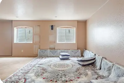 a living room with a couch and a rug at Freesan in DEN