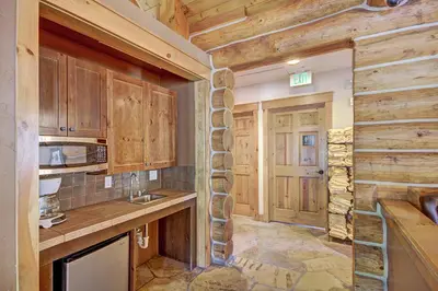 a kitchen with wooden cabinets and a counter top at 6532 Settlers Creek Condo in Keystone