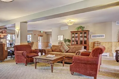 a living room with couches and chairs and a table at 2640 Tenderfoot Lodge Condo in Keystone