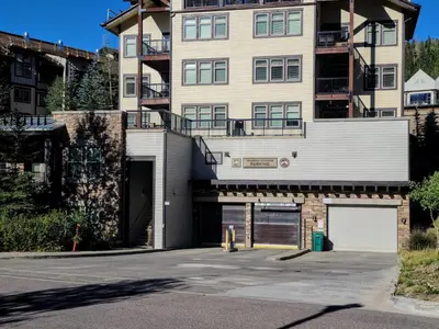 an empty parking lot in front of a building at 4368 Founders Pointe Cozy WP Village Condo in Winter Park