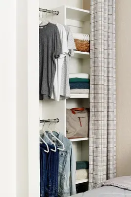 a closet filled with lots of clothes at InTown Suites Extended Stay Denver - Havana Street in Aurora
