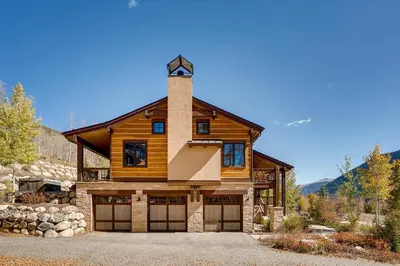 a log home with a tower on top of it at Sanctuary 2569 in Keystone