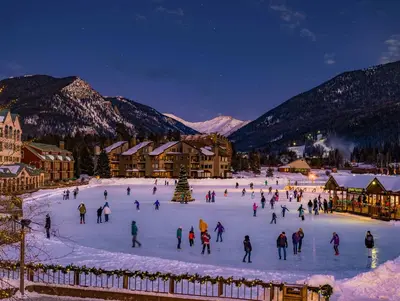a group of people skating on a rink in the snow at Gateway 5069 in Keystone