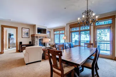 a dining room with a wooden table and chairs at Lone Eagle 3008 in Keystone
