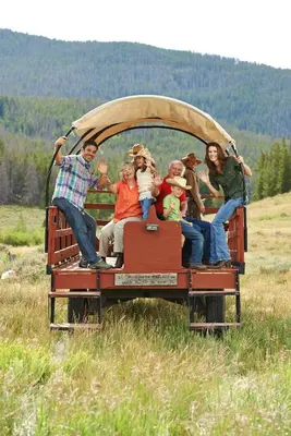 a group of people riding in the back of a truck at Red Hawk Lodge 2207 in Keystone