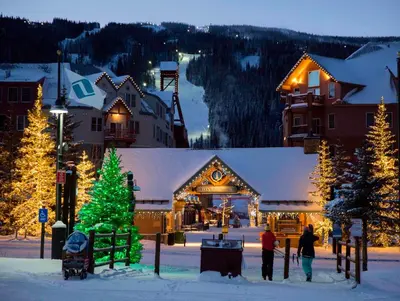 a ski lodge with a christmas tree in the snow at Willows 1716 in Keystone